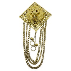 Vintage gold tone lions head ruby red rhinestone eyes chain designer brooch