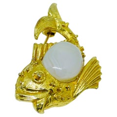 Vintage gold tone milk glass fish figural designer brooch