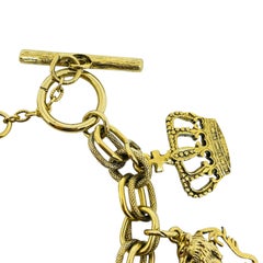 Vintage gold tone multi charm chain glass bracelet lion key