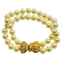 Vintage gold tone pearl bow crystsl designer bracelet