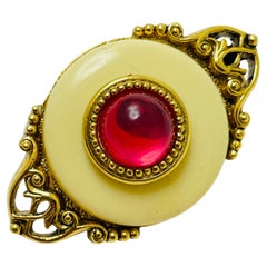 Vintage gold tone pink cream lucite designer brooch
