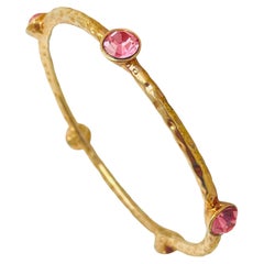 Bracelet vintage avec strass rose et tonalité or