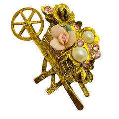 Vintage gold tone pink stones designer brooch