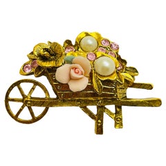 Vintage gold tone pink stones designer brooch