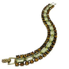 Vintage gold tone prong set rhinestone designer bracelet