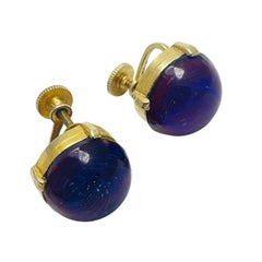 Vintage gold tone purple glass designer screw back earrings