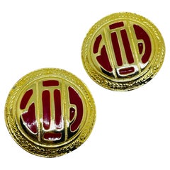 Vintage gold tone red enamel designer clip on earrings