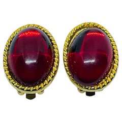 Vintage gold tone red glass designer clip on earrings