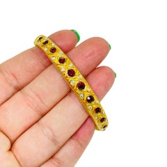 Vintage gold tone red rhinestones designer bangle bracelet