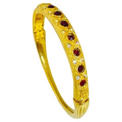 Vintage gold tone red rhinestones designer bangle bracelet