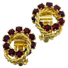 Vintage gold tone red rhinestones small designer clip on earrings