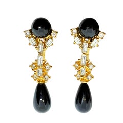 Orecchini vintage in oro con gocce nere di strass di design anni
80