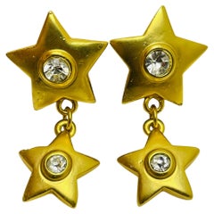 Orecchini a clip con stelle pendenti in strass color oro vintage
