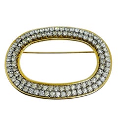 Vintage gold tone rhinestone designer brooch