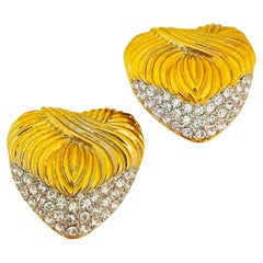 Used gold tone rhinestone heart clip on designer earrings