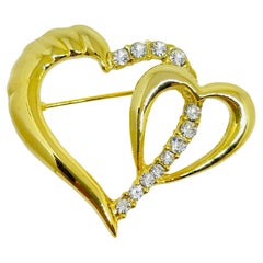 Vintage gold tone rhinestone heart designer brooch