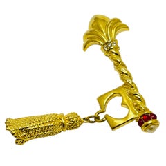 Vintage gold tone rhinestone key heart designer brooch