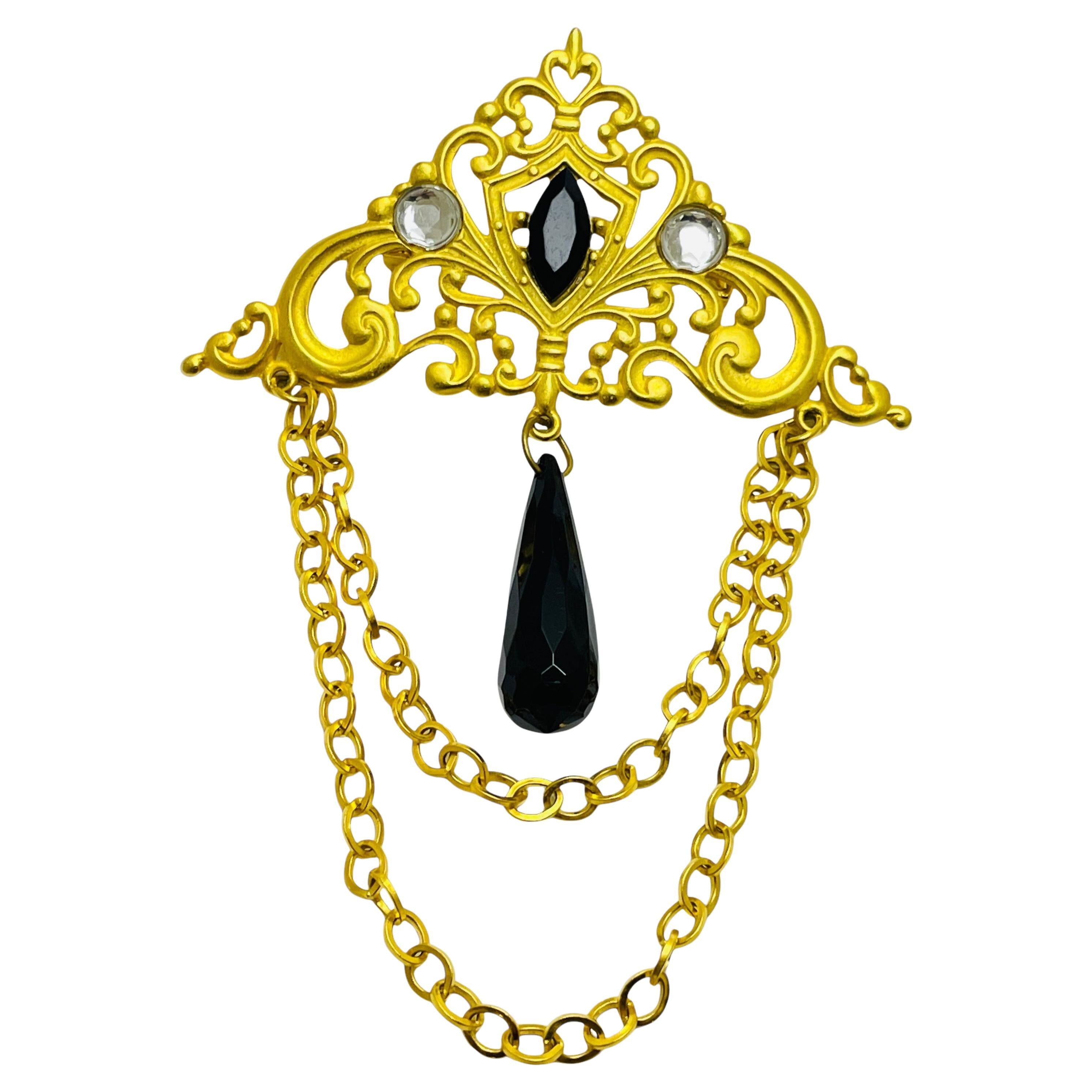 Vintage gold tone rhinestones dangle designer brooch For Sale