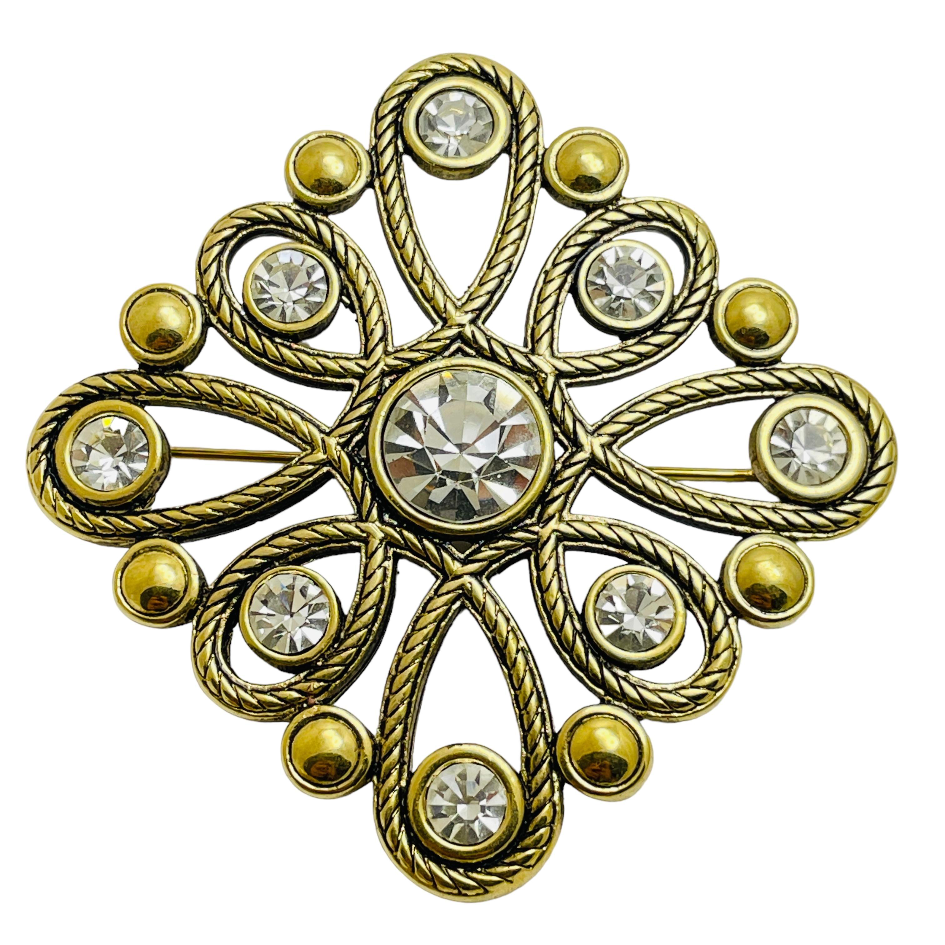 Spilla vintage con strass in tono dorato
