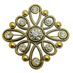 Broche vintage de diseño con strass en tono dorado