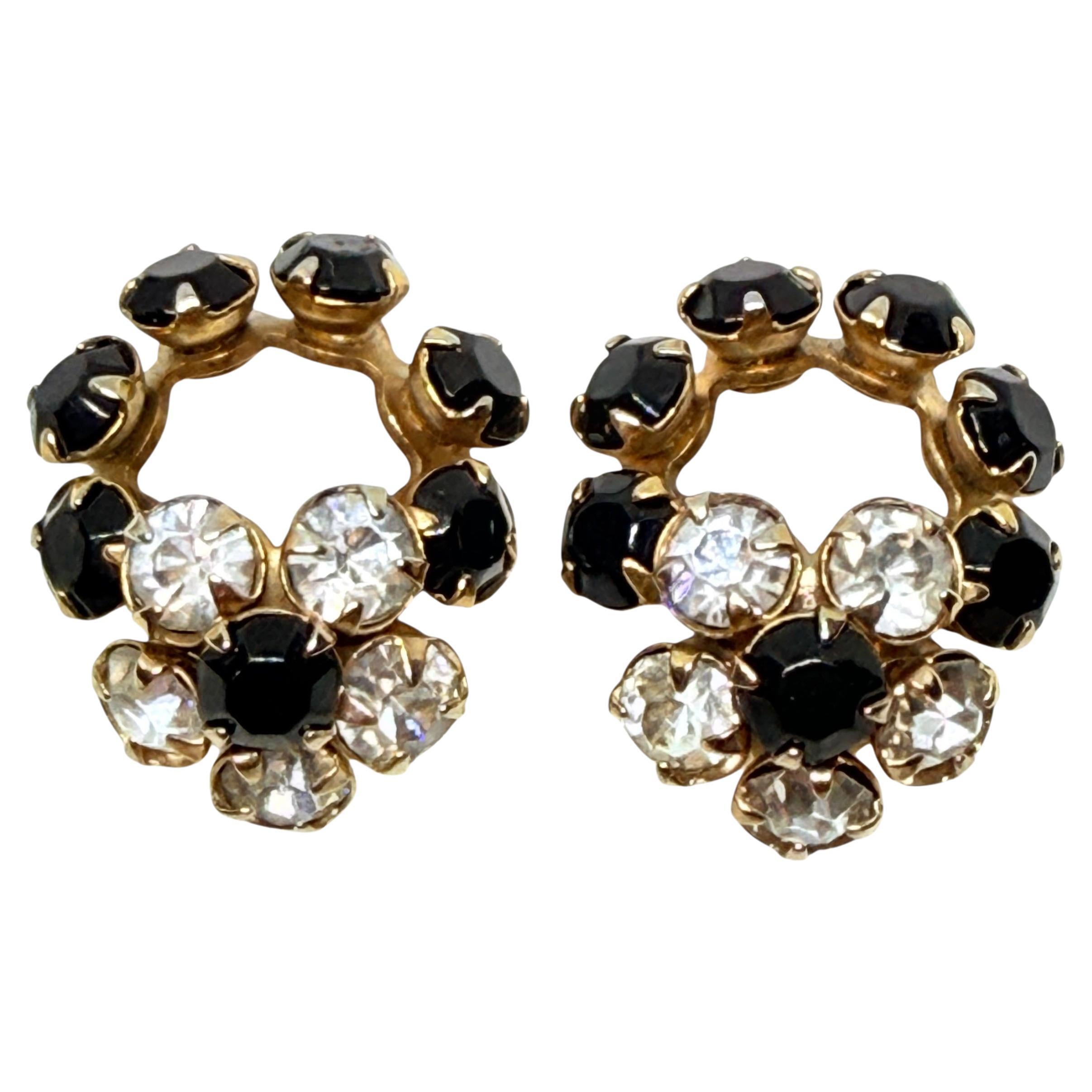 Piccoli orecchini a clip d
epoca con strass a forma di fiore di design