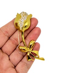 Vintage gold tone rhinestones flower rose with a bow designer brooch