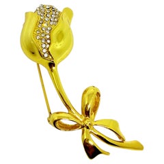 Vintage gold tone rhinestones flower rose with a bow designer brooch