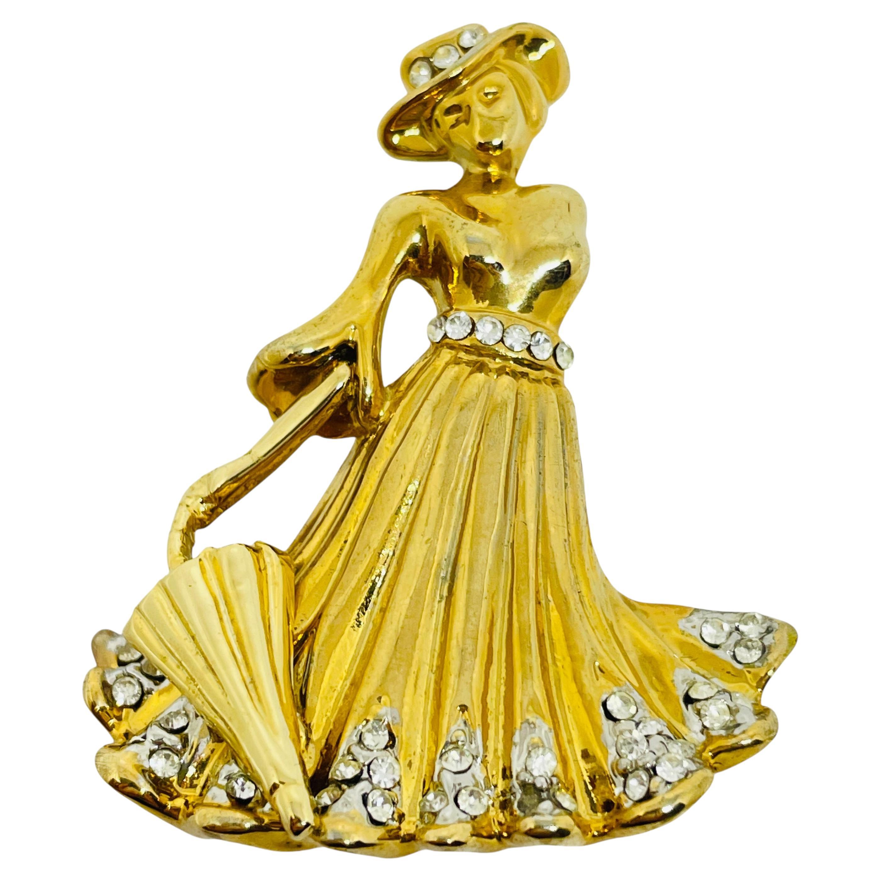 Broche de señora vintage de strass en tono dorado