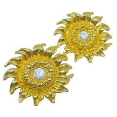 Orecchini a perno vintage in strass color oro con girasole di design anni 
80