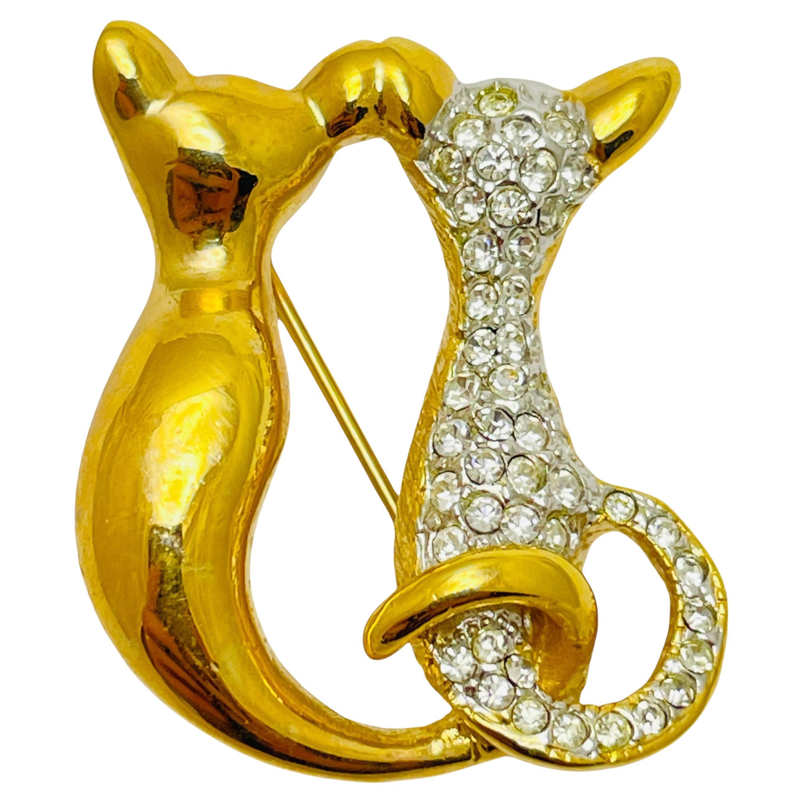 Broche vintage en strass doré avec deux am designs
