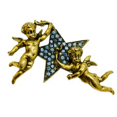 Vintage gold tone sapphire blue rhinestones cherub angels starr designer brooch