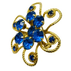 Broche fleurie vintage de couleur or, saphir bleu, strass
