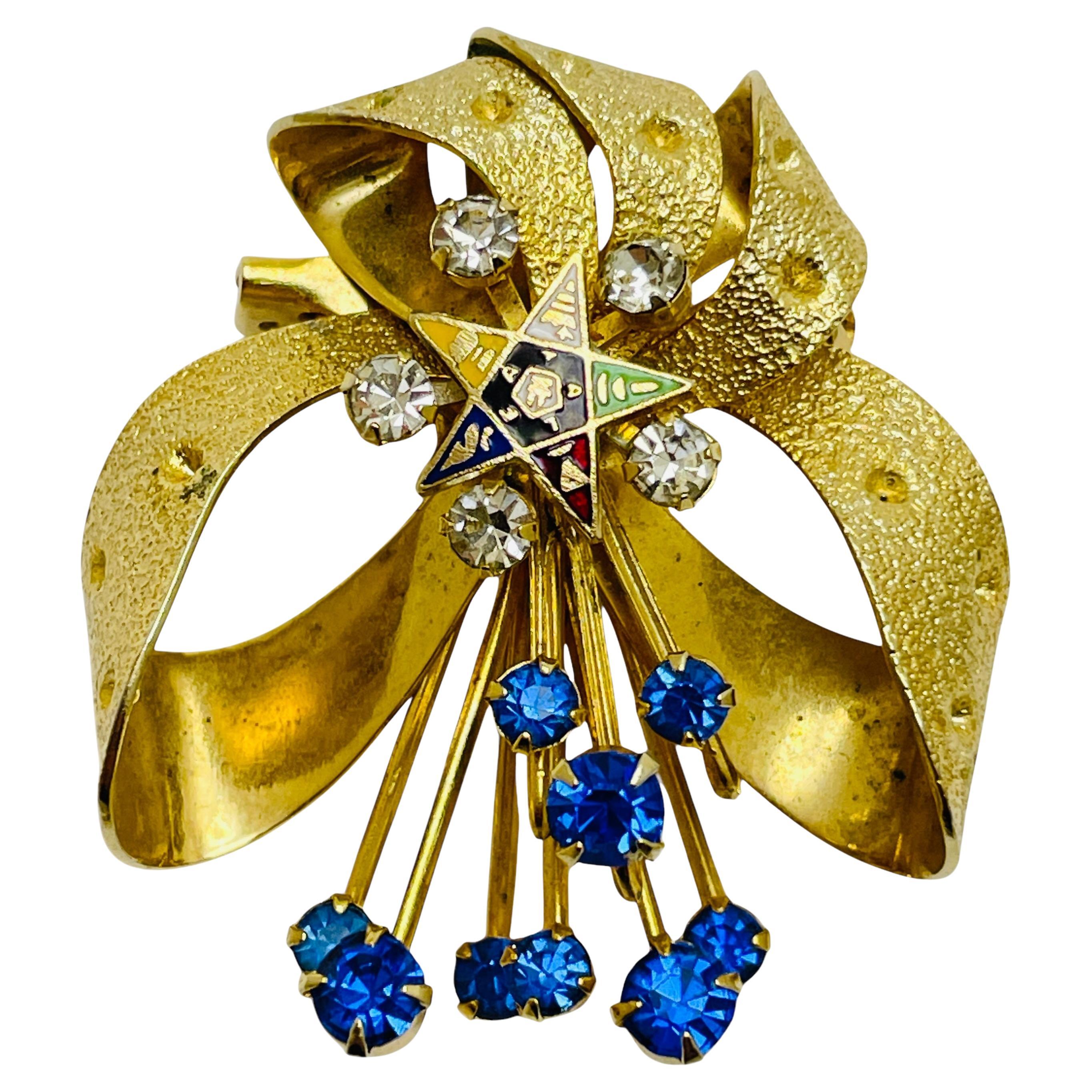 Vintage gold tone sapphire rhinestones enameled star designer brooch