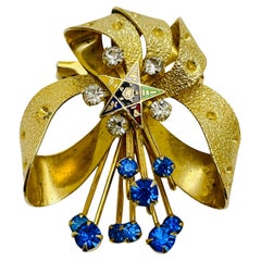 Vintage gold tone sapphire rhinestones enameled star designer brooch