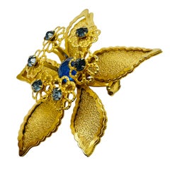 Vintage gold tone sapphire rhinestones flower designer brooch