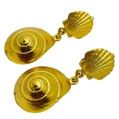 Vintage gold tone seashell dangle designer clip on earrings