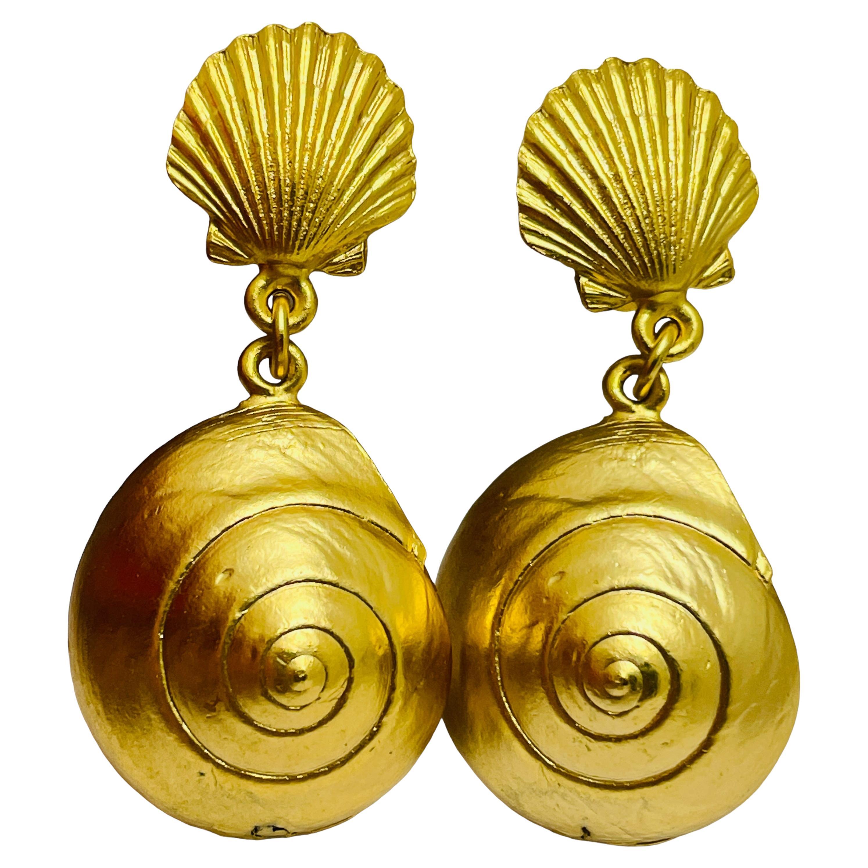 Vintage gold tone seashell dangle designer clip on earrings For Sale