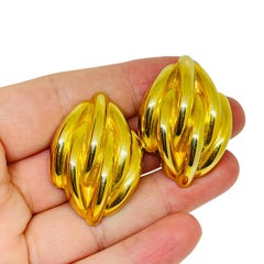 Vintage gold tone shiny massive 80's designer clip on earrings