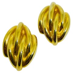 Vintage gold tone shiny massive 80's designer clip on earrings