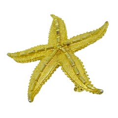 Vintage gold tone starfish designer brooch
