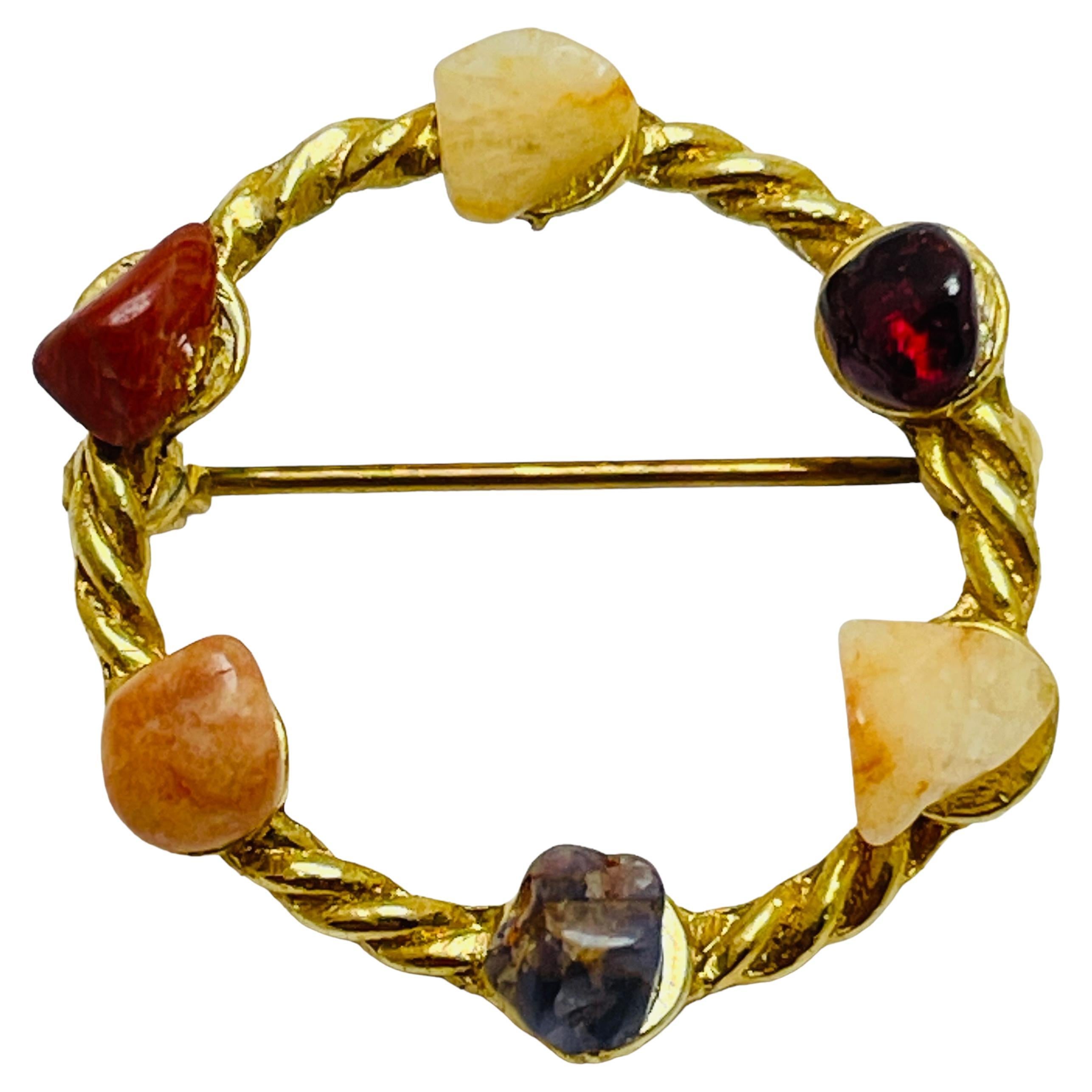 Vintage gold tone stones designer brooch For Sale
