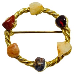 Vintage gold tone stones designer brooch