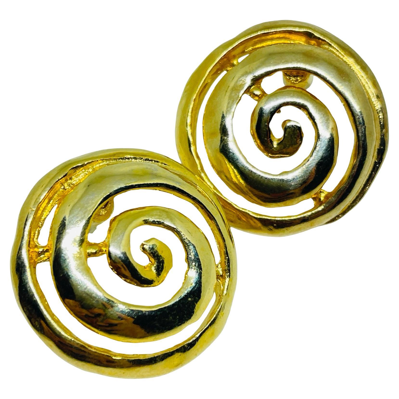 Vintage gold tone swirl designer pierced earrings