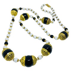 Vintage gold tone white black glass beaded designer necklace