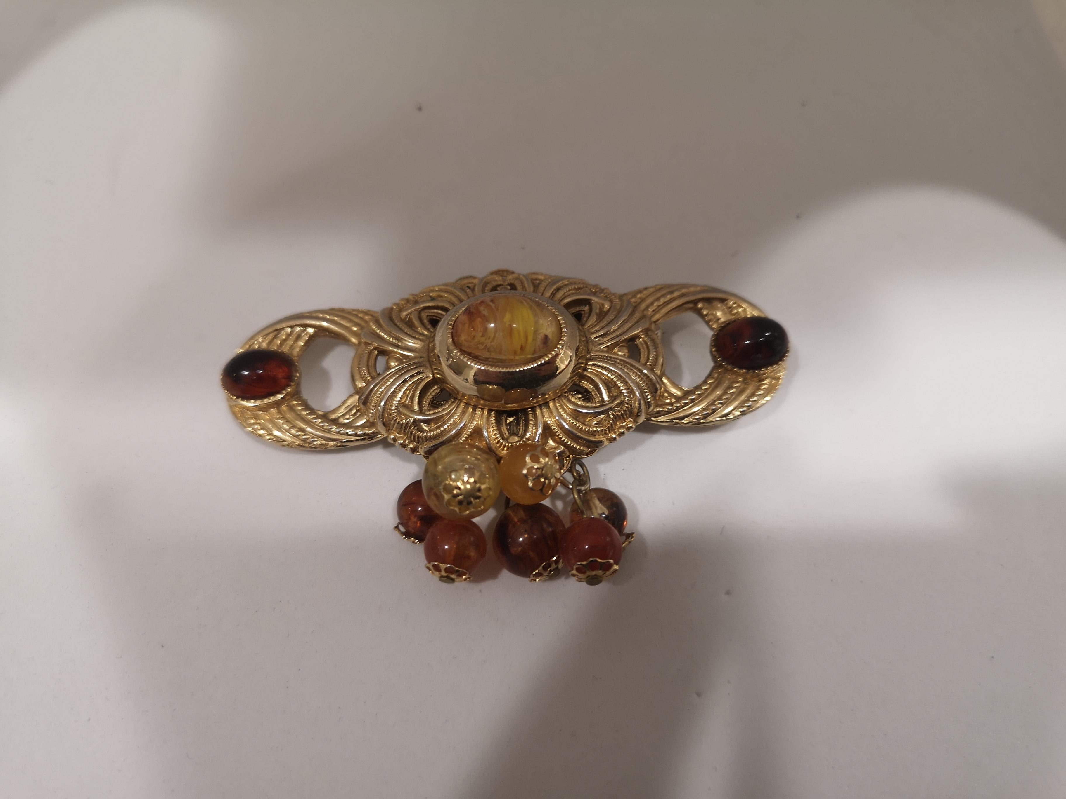 Vintage gold tone with amber stones brooch
8x4 cm