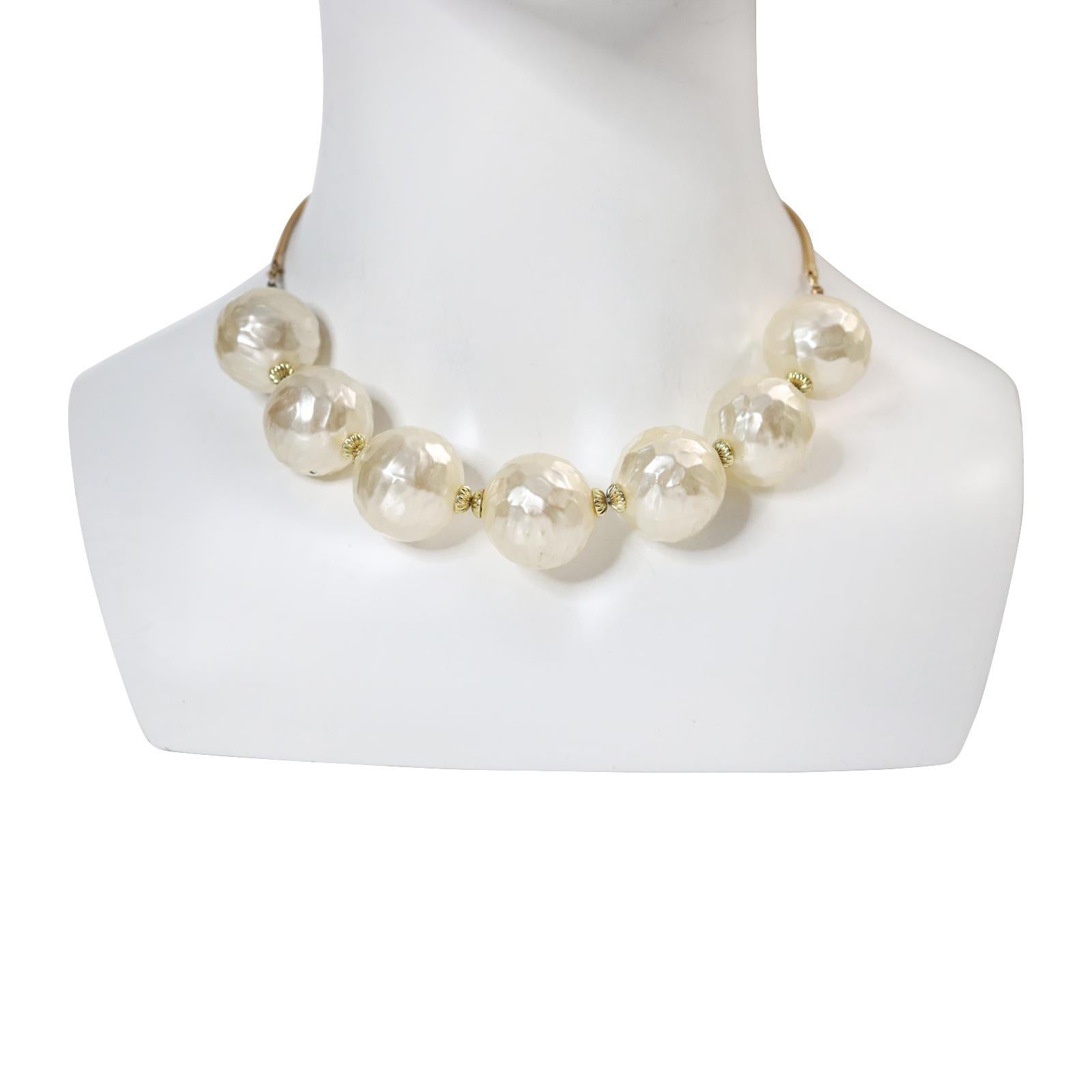 Vintage Gold Tone with Faux Pearls Choker Necklace Circa 1960s.  Can be worn alone or mixed and matched with small necklaces or other accessories. An actual layering piece!

16