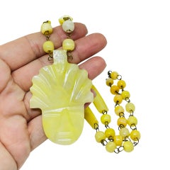 Vintage gold tone yellow glass aztec pendant beaded designer necklace