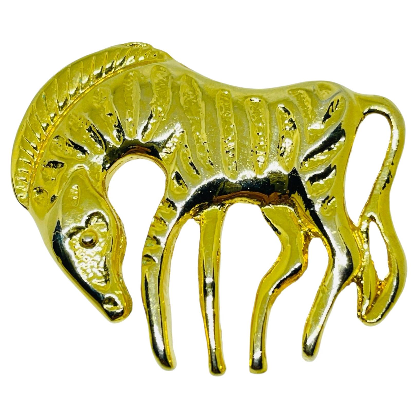 Broche vintage en or avec figurine d'animal zébré de designer