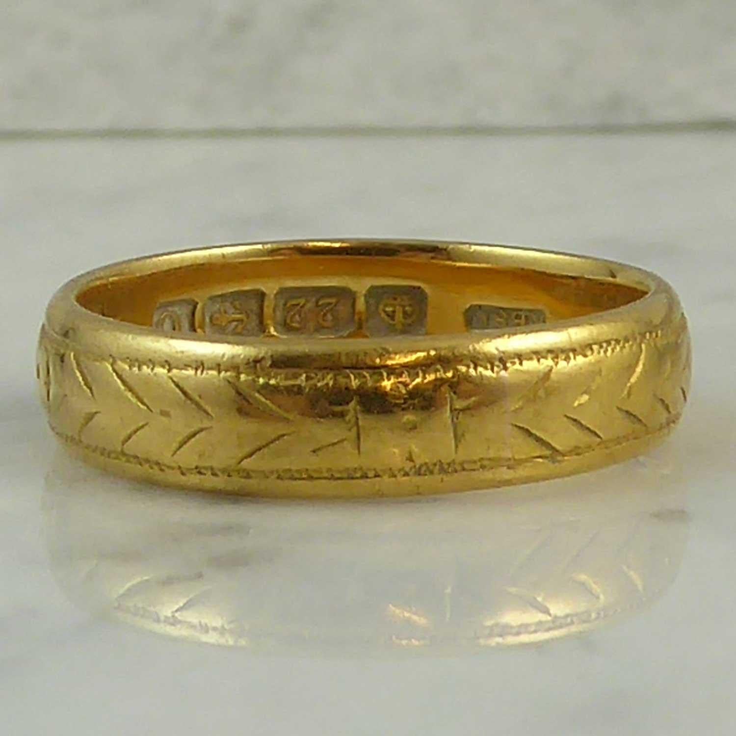 A vintage wedding ring hallmarked at the Birmingham Assay Office in 1938.  Fashioned in warm 22ct yellow gold the ring features a delicate chevron pattern all around.  Finger size  5 7/8 (US/Canada); L1/2 (UK/Australia).