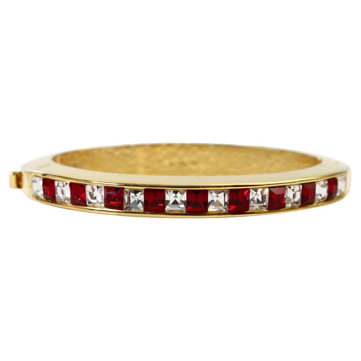 This rigid gold articulated bracelet is so well made.  The red and clear crystals are channel set and the gold is shiny.  These are perfect for stacking or for wearing alone.  I'm have several that I have not listed yet in various looks so let me